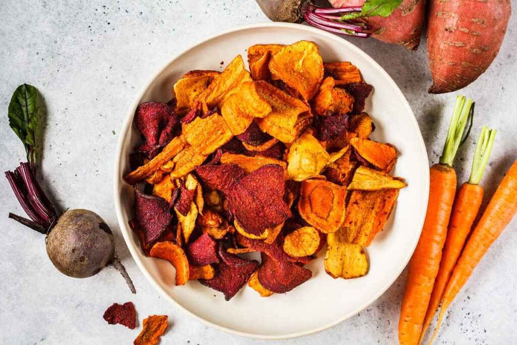 Bowl of healthy vegetable chips with beets sweet for the Best Keto Snacks