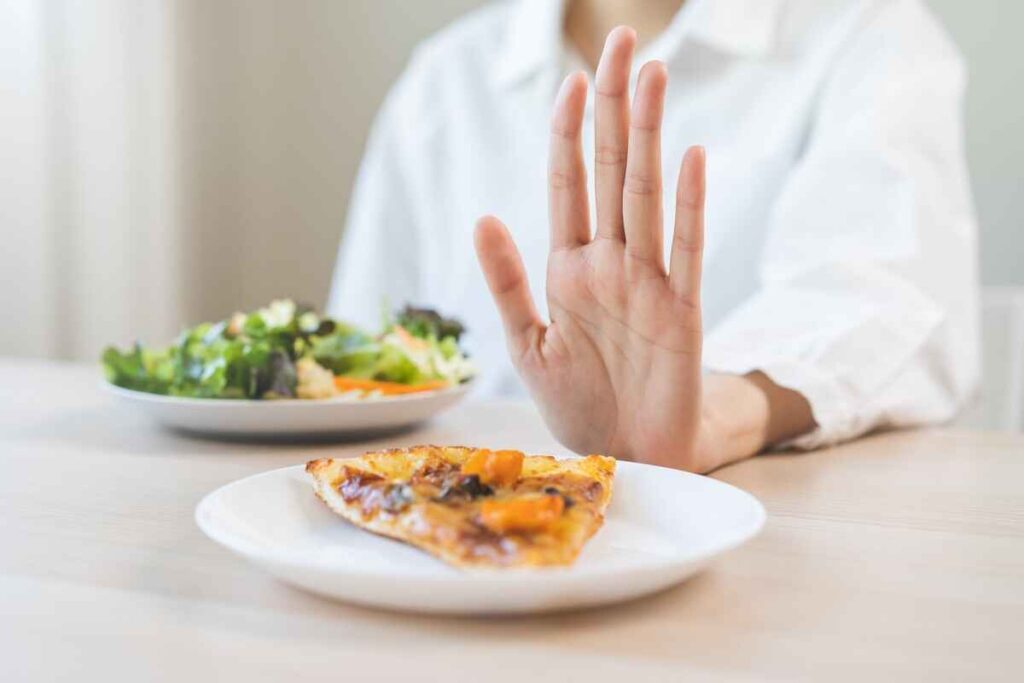 Woman avoiding junk food